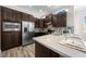 Bright kitchen boasts stainless steel appliances, breakfast bar seating, and ample cabinet storage at 9121 Laureate Blvd, Orlando, FL 32827