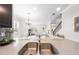 This spacious kitchen boasts modern appliances, including a stainless-steel sink and sleek countertops at 9121 Laureate Blvd, Orlando, FL 32827