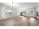 This living room offers beautiful wood-look tile flooring and plenty of natural light at 9121 Laureate Blvd, Orlando, FL 32827