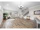 Bright living room with wood floors, bar and staircase to the second floor at 9121 Laureate Blvd, Orlando, FL 32827