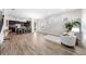 Spacious living room with open floor plan, hardwood floors, and abundant natural light at 9121 Laureate Blvd, Orlando, FL 32827
