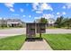 Neighborhood mailboxes with townhomes in the background showcase the residential community at 9121 Laureate Blvd, Orlando, FL 32827
