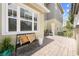 Inviting patio with comfortable seating, a stylish bench, and a view of the surrounding landscape at 9121 Laureate Blvd, Orlando, FL 32827