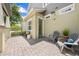 Outdoor patio with brick pavers, seating area, and view of the yard at 9121 Laureate Blvd, Orlando, FL 32827