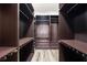 Custom closet with built-in shelving, drawers, and ample storage space for clothes and accessories at 9121 Laureate Blvd, Orlando, FL 32827