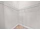 Neutral walk-in closet features wire shelving for storage and organization at 9121 Laureate Blvd, Orlando, FL 32827