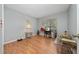 Bedroom featuring laminate floors and a sewing machine at 10934 Rushwood Way, Clermont, FL 34714