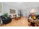 Living room featuring a sofa, chairs, tables, light fixture and decor at 10934 Rushwood Way, Clermont, FL 34714