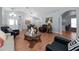 Spacious living room with vaulted ceiling, wood-look floors and plentiful seating at 10934 Rushwood Way, Clermont, FL 34714