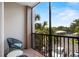 Balcony view showcasing the serene surroundings and community parking at 1351 Venezia Ct # 201, Davenport, FL 33896