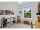 Comfortable bedroom featuring a rocking chair, ample storage, and a bright window offering a relaxing and functional space at 1351 Venezia Ct # 201, Davenport, FL 33896