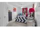 Stylishly decorated bedroom with a unique patterned bedspread and ample natural light at 1351 Venezia Ct # 201, Davenport, FL 33896