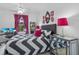 Bright bedroom featuring chevron bedding, modern mirrored nightstand, and stylish decor for a chic, comfortable space at 1351 Venezia Ct # 201, Davenport, FL 33896