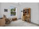 Cozy room with a rocking chair, natural light, and built-in storage, creating an inviting workspace or hobby area at 1351 Venezia Ct # 201, Davenport, FL 33896