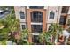 Close up of exterior facade showing multiple balconies with open and screened in designs at 1351 Venezia Ct # 201, Davenport, FL 33896