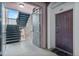 Hallway featuring stairs to the upper floors, and the front door to unit 201 at 1351 Venezia Ct # 201, Davenport, FL 33896