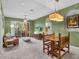 Bright living room featuring a balcony, dining area, and comfortable seating at 1351 Venezia Ct # 201, Davenport, FL 33896