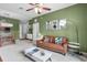 Comfortable living room includes a view of the balcony and an adjacent dining area at 1351 Venezia Ct # 201, Davenport, FL 33896