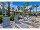 Beautiful pool with lounge chairs and sunshades for relaxing by the water at 1351 Venezia Ct # 201, Davenport, FL 33896