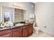 Bathroom featuring a granite countertop, neutral tile flooring, and modern toilet at 1361 Tuscan Ter # 7303, Davenport, FL 33896