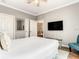 Bedroom with neutral walls, wood floors, and a ceiling fan for comfort at 1361 Tuscan Ter # 7303, Davenport, FL 33896