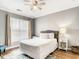 Inviting bedroom with a cozy throw pillow and a nightstand with modern lamp at 1361 Tuscan Ter # 7303, Davenport, FL 33896