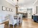 Bright dining area featuring modern decor and an open floor plan that connects to the kitchen at 1361 Tuscan Ter # 7303, Davenport, FL 33896