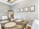 Dining area featuring a rustic wooden table and minimalist decor creating a cozy atmosphere at 1361 Tuscan Ter # 7303, Davenport, FL 33896