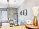 Dining room with wood-look floors and light fixture, perfect for gatherings at 1361 Tuscan Ter # 7303, Davenport, FL 33896