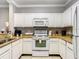 Bright kitchen featuring appliances, neutral countertops, and white cabinets at 1361 Tuscan Ter # 7303, Davenport, FL 33896