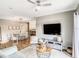 Comfortable living room with an open view of the dining area and a modern ceiling fan at 1361 Tuscan Ter # 7303, Davenport, FL 33896