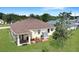 Aerial view showcasing the backyard, patio, shed, and well-manicured lawn at 1405 Hillsborough Way, Kissimmee, FL 34759