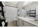 Bathroom features a shower-tub combo, large vanity, and tiled floors at 1405 Hillsborough Way, Kissimmee, FL 34759