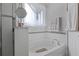 Bathroom features a tub with a shower and decorative wall tiles at 1405 Hillsborough Way, Kissimmee, FL 34759