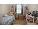 Cozy bedroom featuring charming decor, natural light, and comfortable furniture at 1405 Hillsborough Way, Kissimmee, FL 34759
