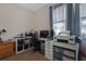 Guest bedroom features a desk and workspace with an abundance of storage space at 1405 Hillsborough Way, Kissimmee, FL 34759