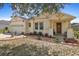 Inviting home featuring a well-manicured lawn, charming front porch, and lovely landscaping at 1405 Hillsborough Way, Kissimmee, FL 34759