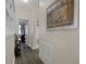 Hallway features hard surface floors and neutral walls that lead to the main bedroom and bathroom at 1405 Hillsborough Way, Kissimmee, FL 34759