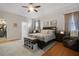 Spacious main bedroom with an open entry to the main bath and walk-in closet at 1405 Hillsborough Way, Kissimmee, FL 34759