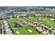 This aerial view captures the community homes and golf course at 1452 Mickelson Ct, Davenport, FL 33896