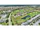 The aerial shot shows community with golf course, pools, and picturesque landscaping at 1452 Mickelson Ct, Davenport, FL 33896