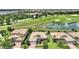 Beautiful aerial view of a community with well-maintained landscaping and golf course and lakes at 1452 Mickelson Ct, Davenport, FL 33896