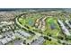 Aerial view of the homes and lush golf course located within the community at 1452 Mickelson Ct, Davenport, FL 33896
