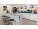 This house has a bar with barstools, a microwave, and a sink at 1452 Mickelson Ct, Davenport, FL 33896
