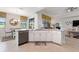 Modern kitchen with sleek white cabinetry, stainless steel appliances, and a view of the outdoor space at 1452 Mickelson Ct, Davenport, FL 33896
