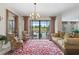 Elegant sitting room leading to an outdoor pool and patio area at 1452 Mickelson Ct, Davenport, FL 33896