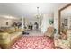 Bright living area with pool access featuring a view to the kitchen and dining area at 1452 Mickelson Ct, Davenport, FL 33896