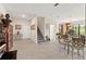 This living room has stairs, a front entryway, and dining area at 1452 Mickelson Ct, Davenport, FL 33896