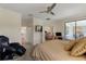 Spacious main bedroom with a view of the outdoor patio, walk-in closets, and an adjacent sitting area at 1452 Mickelson Ct, Davenport, FL 33896