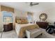 Serene main bedroom featuring a plush bed, elegant decor, and plenty of natural light at 1452 Mickelson Ct, Davenport, FL 33896